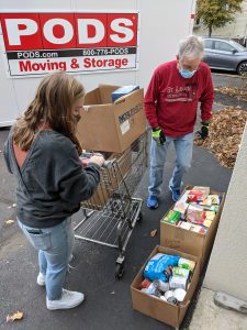 Volunteers boxing up food donations