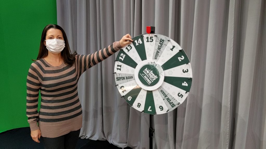 Paula Daniels spins the Wheel of Chance