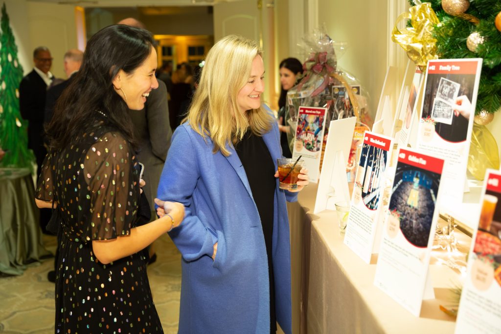 Gala attendees browse the silent auction packages at the 2019 Feed the Hungry Gala.