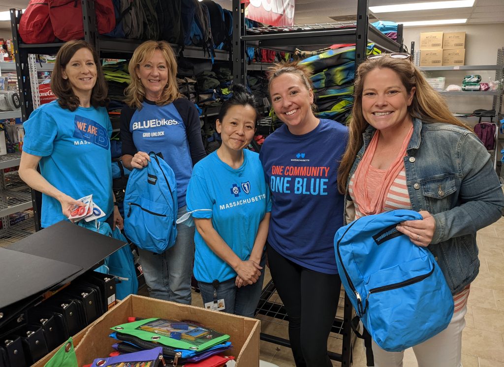 Volunteers from Blue Cross Blue Shield of Massachusetts helped sort supplies and fill backpacks for Interfaith Social Services' Backpack Drive