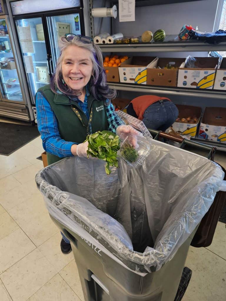 Interfaith's Food Pantry manager Eileen Kelly composts vegetables that are not fit for consumption.