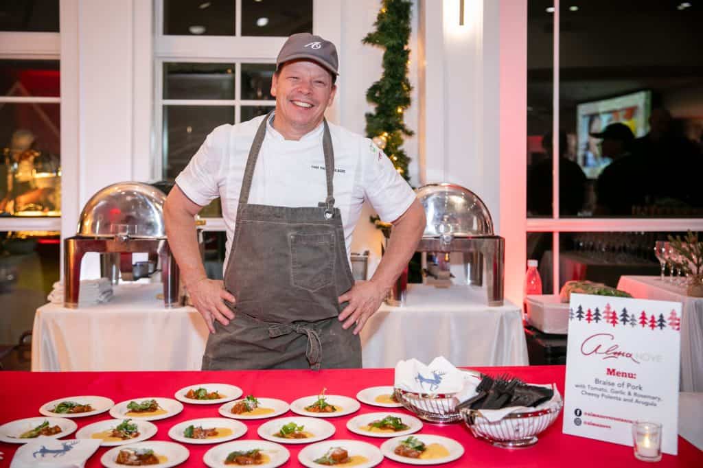 Chel Paul Wahlberg of Hingham’s Alma Nove restaurant served up sample plates of braised pork with cheesy polenta for guests at Interfaith Social Services’ Dec. 6 Feed the Hungry Gala. Attendees sampled food and beverages from more than a dozen local restaurants and breweries at the organization’s annual fundraising event. Credit –Matt Teuten Photography