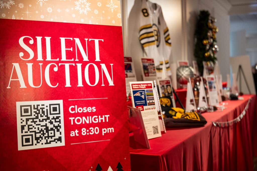 The silent auction at Interfaith Social Services’ Dec. 6 Feed the Hungry Gala featured Boston sports tickets, a Maine vacation, a team-autographed Bruins jersey, a Cape Cod glassblowing experience, hotel stays and much more. Credit –Matt Teuten Photography