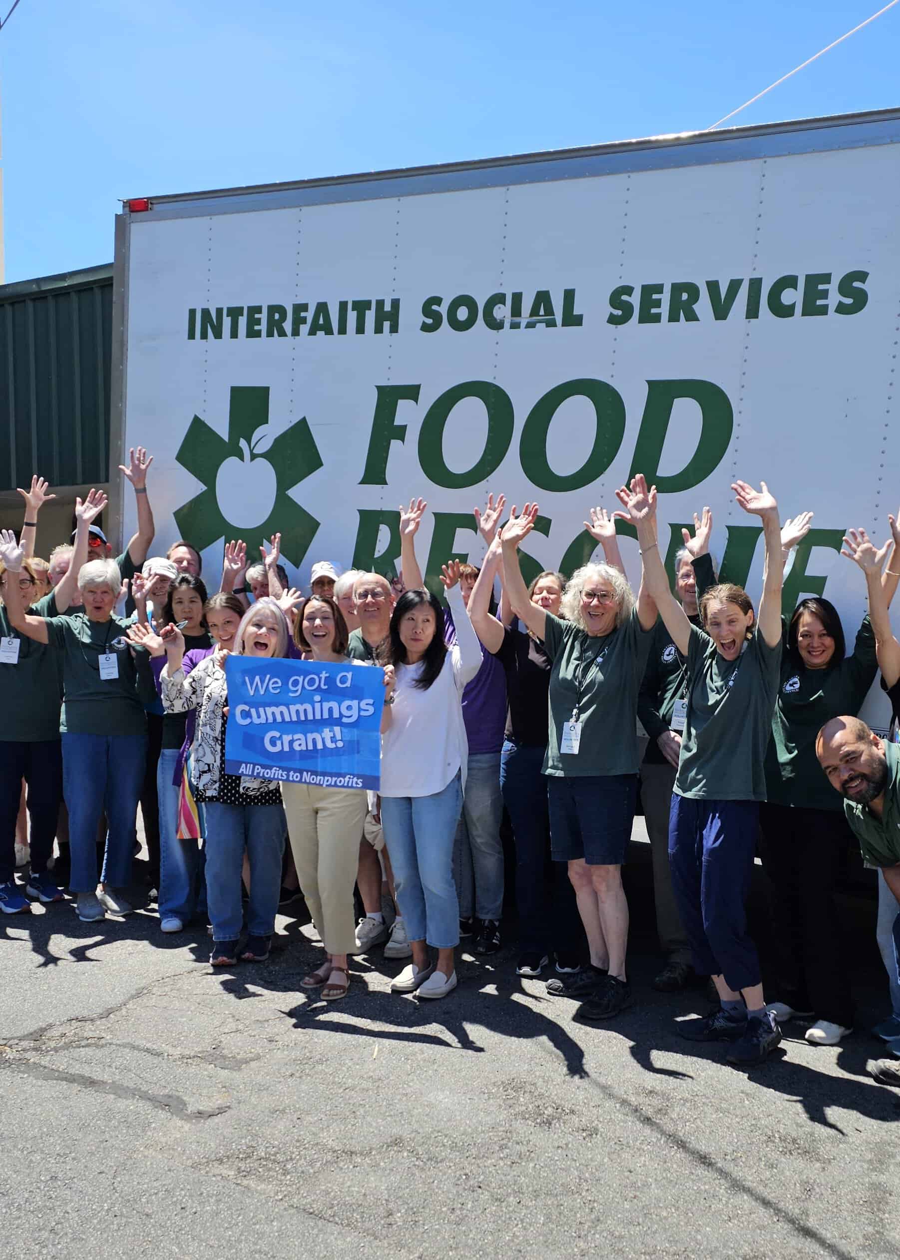 Interfaith staff and volunteers celebrate their Cummings Grant