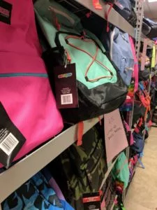 Hundreds of donated backpacks given to school children