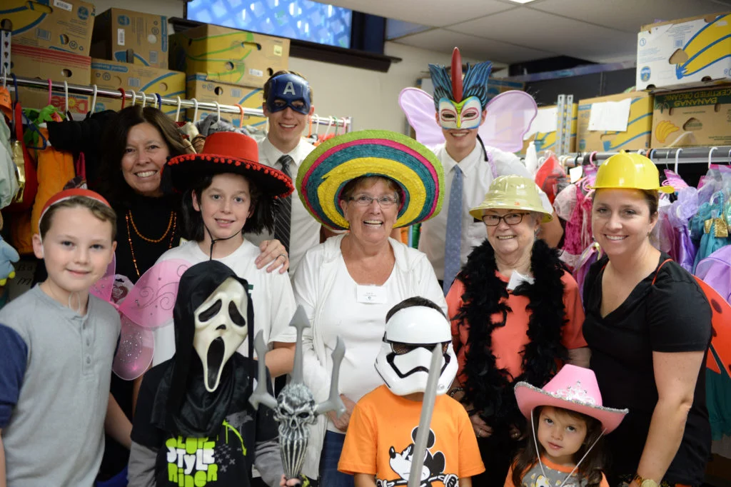 A few of Interfaith's enthusiastic volunteers took a break to get silly during the distribution. Photo by Hurley Event Photography.