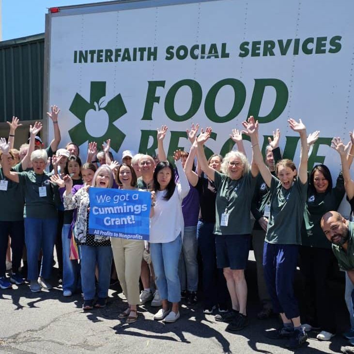 Interfaith staff and volunteers celebrate their Cummings Grant