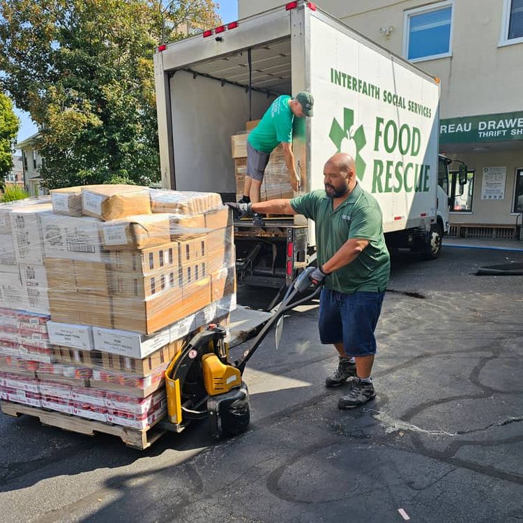 Interfaith Social Services’ Food Rescue Coordinators Geoff Bowen (foreground) and Dritan Spiro assist in recovering more than 8,000 pounds of food each week from local grocery stores and retailers. The rescued food, which otherwise would have ended up in landfills, is redistributed to the organization’s food pantry clients.