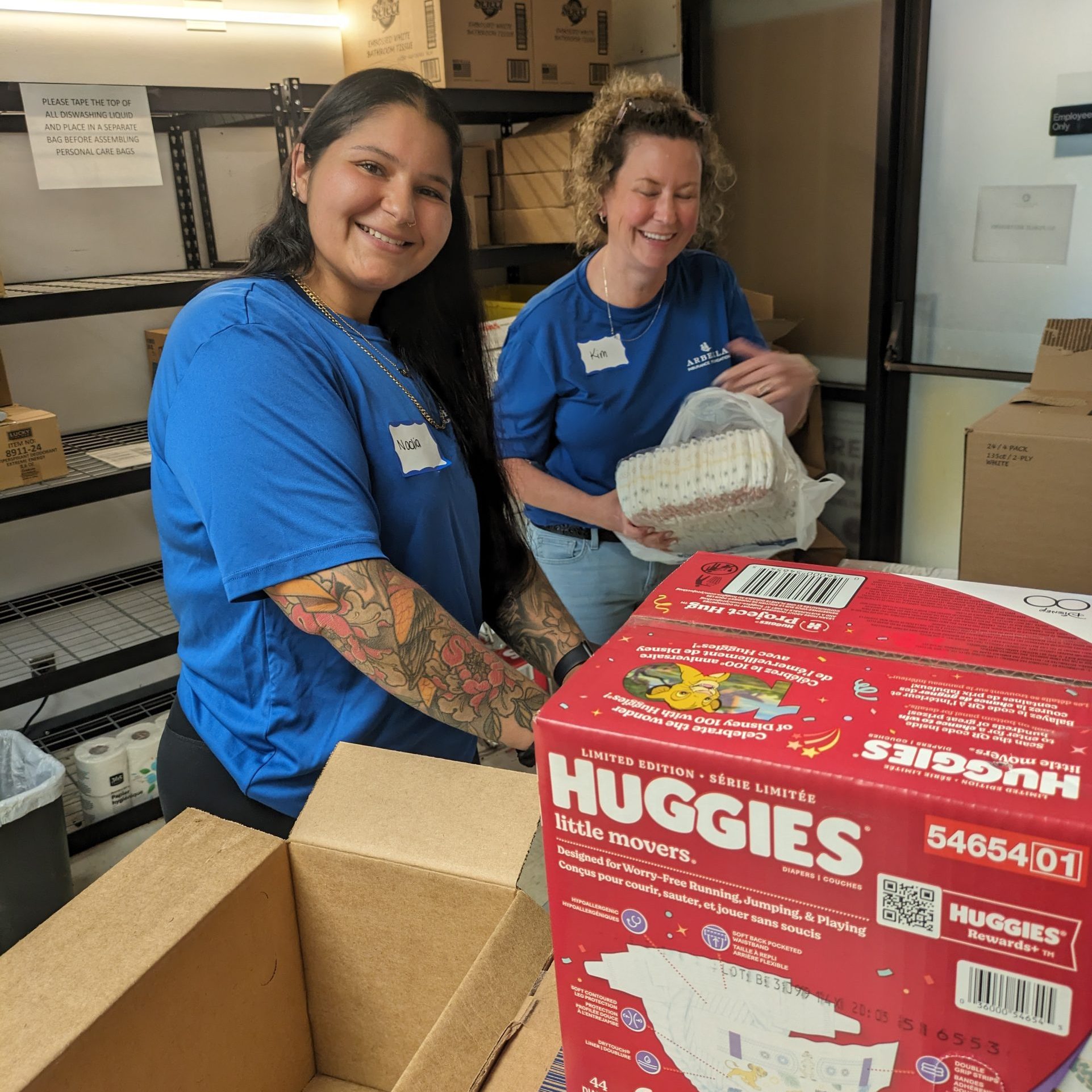 Volunteers in Interfaith's food pantry pack diapers