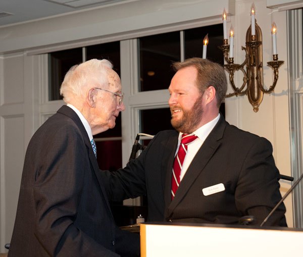 Interfaith's Executive Director Rick Doane, right, honors Bob Taylor with the Community Hero Award at the 20th Annual Feed the Hungry Gala.